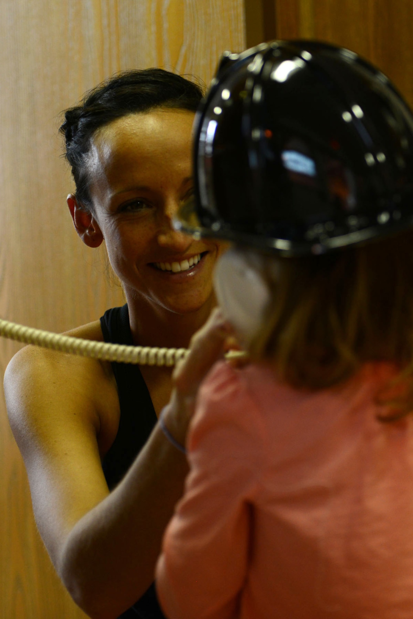 U.S. Army Sgt. 1st Class Erin  Miller, Army Reserve Careers Division career counselor, helps her daughter, Kaelin, dial 911 during an open house at the Fort Eustis Fire Department at Fort Eustis, Va., Oct. 12, 2013. Children as young as 3 years old can be taught to dial 911 in case of an emergency. (U.S. Air Force photo by Staff Sgt. Ciara Wymbs/Released)