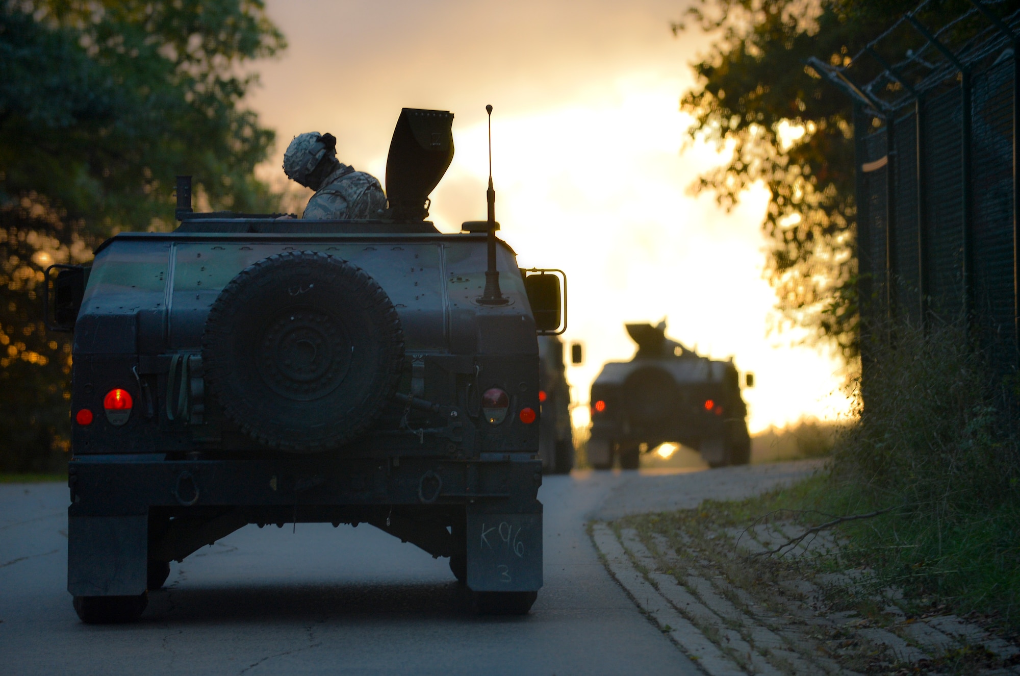 A convoy of HUMVEEs transport Creek Defender students to a training facility, Oct. 15, 2013, Baumholder, Germany. Students participating in the Creek Defender course must pass a 24-section evaluation to prepare them for deployed environments around the world. (U.S. Air Force photo/Airman 1st Class Jordan Castelan)