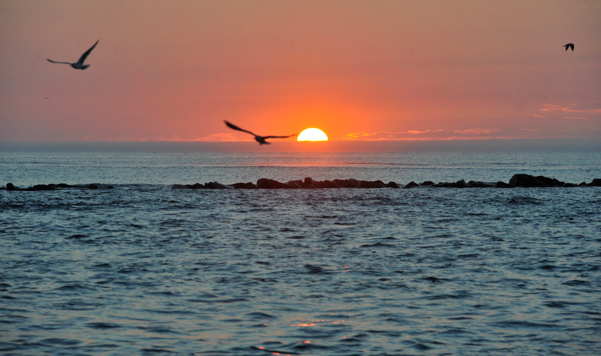 The sun rises over the Atlantic Ocean Oct. 5, 2013, as Airmen from Shaw Air Force Base, S.C., begin a  day of deep-sea fishing. Airmen caught red snapper, sea bass, and even an Atlantic sharpnose shark. (U.S. Air Force photo by Airman 1st Class Jonathan Bass/Released)