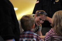 A Ward County Sherriff’s Deputy interacts with children about the importance of staying out of trouble, during the Minot Police Department’s Operation Mugs and Hugs hosted in Minot, N.D., Oct. 12. With assistance from various community organizations, as well as Team Minot Airmen, Minot PD officers provided children with stickers, bags, utensils and other memorabilia promoting community safety tips. (U.S. Air Force photo/Senior Airman Jose L. Hernandez)