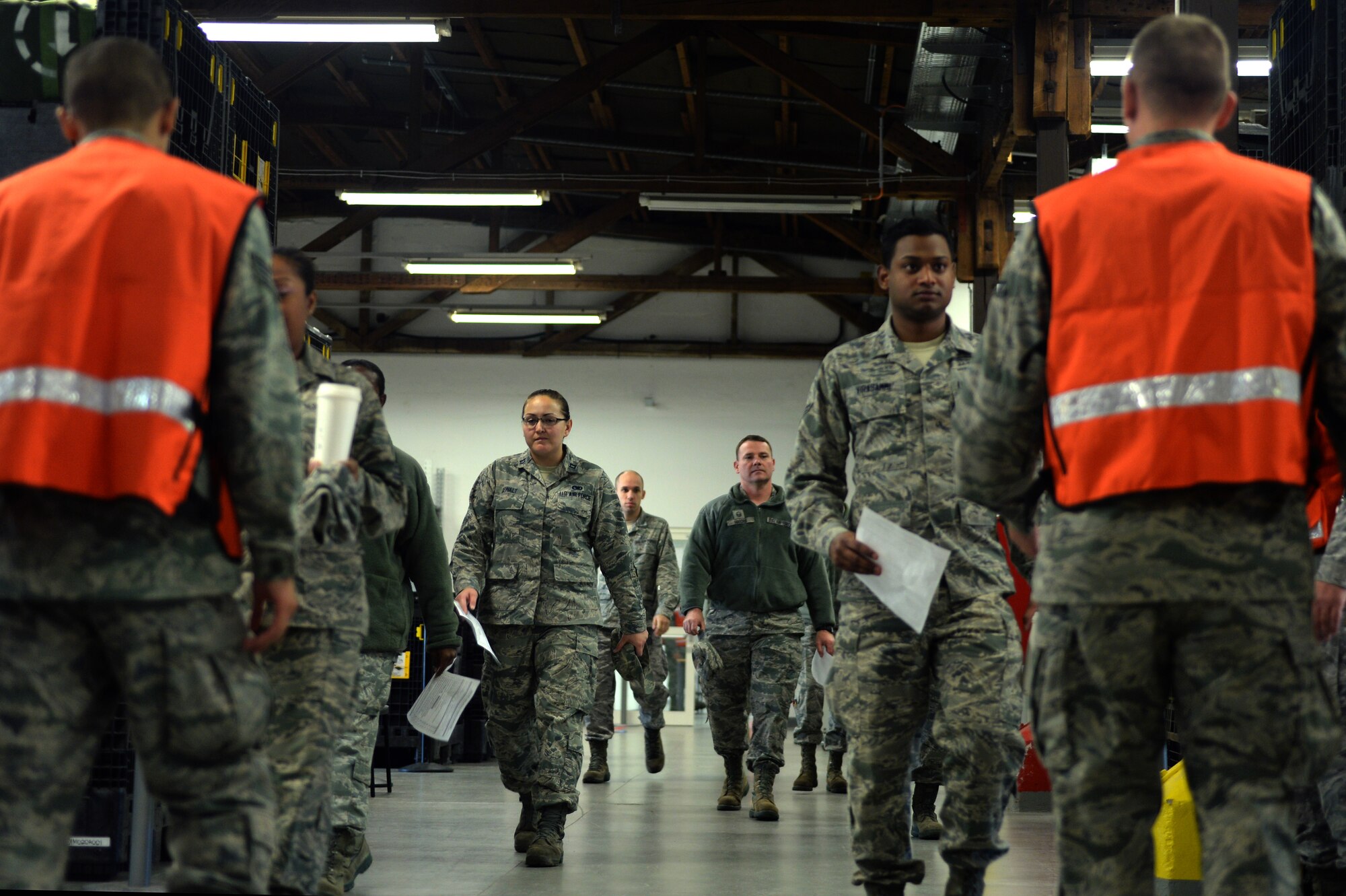 Airmen line up to be processed for their flu mist injection during a medical exercise Oct. 16, 2013. The 52nd Medical Group personnel aimed to provide flu vaccinations to the base's more than 4,000 active-duty personnel. (U.S. Air Force photo by Senior Airman Alexis Siekert/Released)