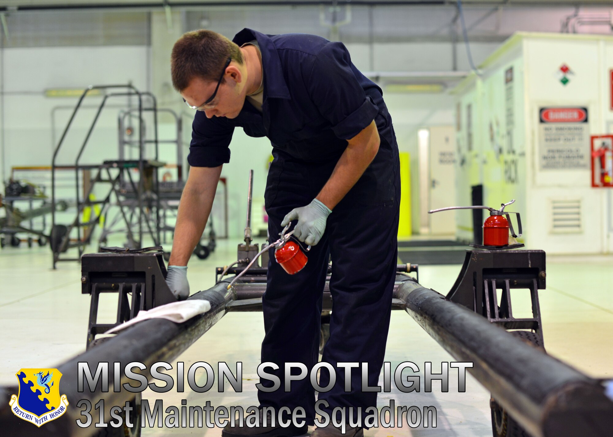 Airman 1st Class Kyle Bathory, 31st Maintenance Squadron aerospace ground equipment journeyman, applies lubricant to a dolley, Oct. 10, 2013, at Aviano Air Base, Italy. The AGE shop is comprised of 71 Airmen who service, inspect, troubleshoot and repair engine-driven motors, heaters, air conditioners, compressors and bomb lifts. (U.S. Air Force photo/Senior Airman Briana Jones)