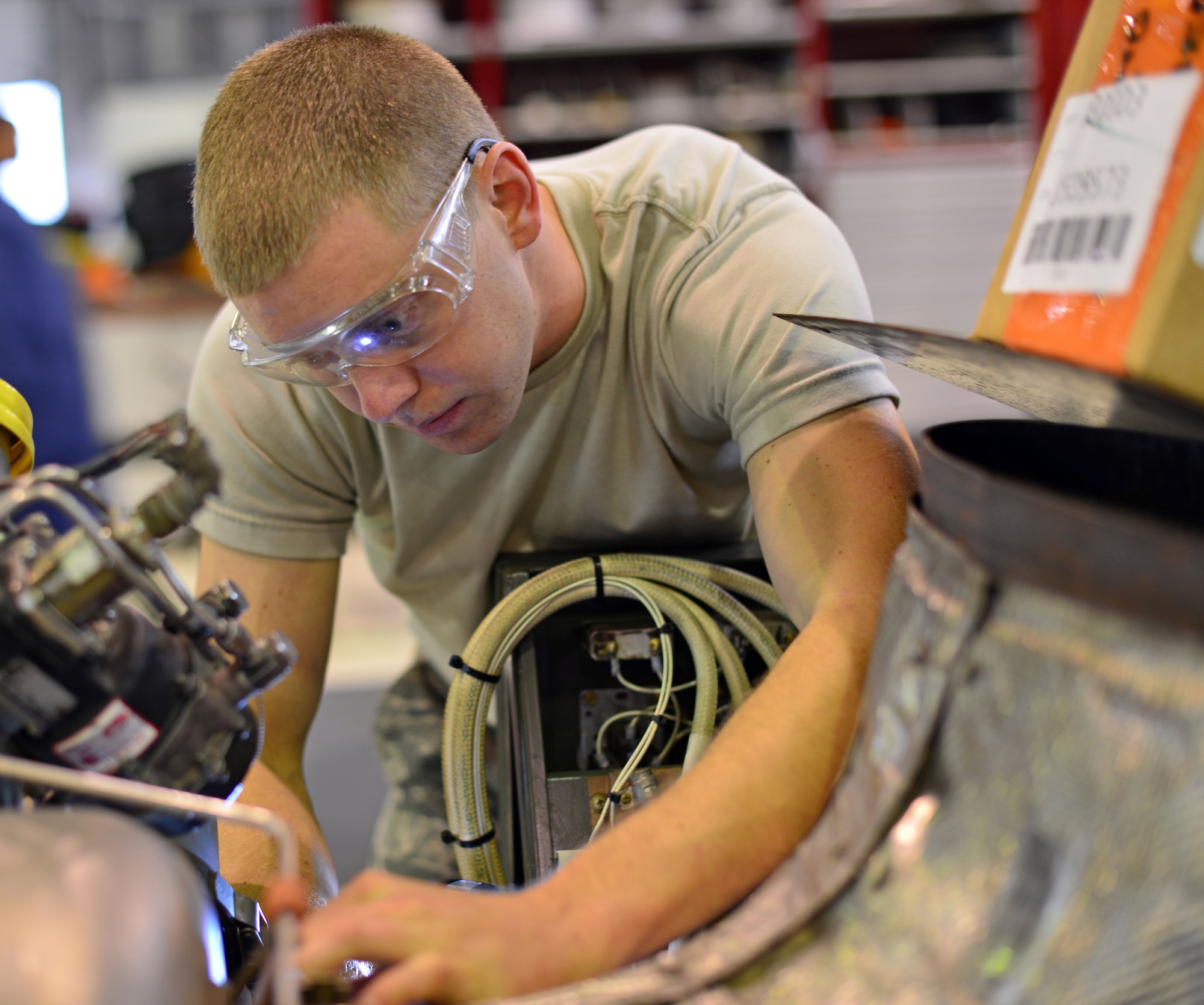 Staff Sgt. Mitchell Tindal aerospace ground equipment craftsman, replaces wires on a generator, Oct. 10, 2013, at Aviano Air Base, Italy. AGE Airmen work around the clock to support Aviano’s flying mission, while also providing multiple squadrons with ground equipment. (U.S. Air Force photo/Senior Airman Briana Jones)