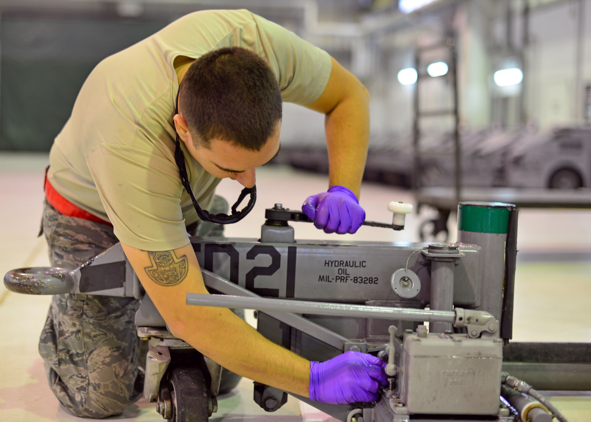 Airman 1st Class Vincent Obregon, 31st Maintenance Squadron aerospace ground equipment journeyman, replaces screws on a dolley, Oct. 10, 2013, at Aviano Air Base, Italy. Obregon performs maintenance on broken equipment and troubleshoots it to isolate the problem and get the equipment mission capable. (U.S. Air Force photo/Senior Airman Briana Jones)