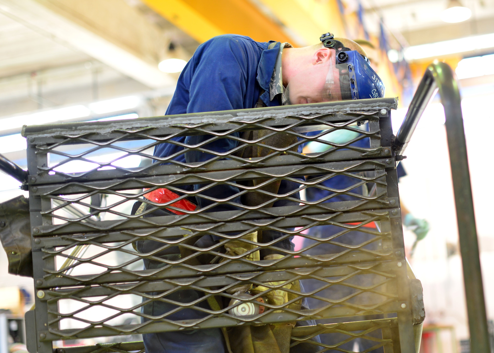 Senior Airman Patrick Dickason, 31st Maintenance Squadron aerospace ground equipment journeyman, performs maintenance on a stand, Oct. 9, 2013, at Aviano Air Base, Italy. The AGE shop is comprised of 71 Airmen who service, inspect, troubleshoot and repair engine-driven motors, heaters, air conditioners, compressors and bomb lifts. (U.S. Air Force photo/Senior Airman Briana Jones)