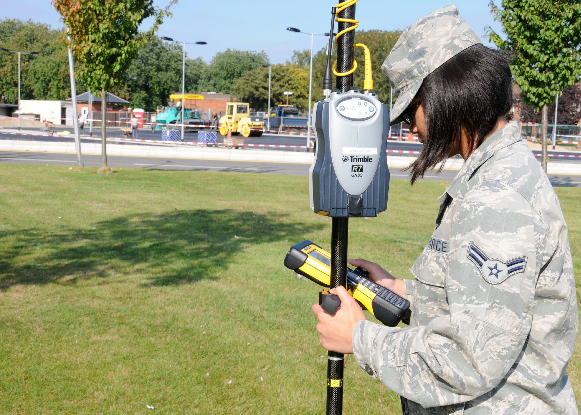 U.S. Air Force Airman 1st Class Abigail Cheek, 100th Civil Engineer Squadron engineering apprentice from Fairfax, Va., uses a global positioning system rover Sept. 27, 2013, on RAF Mildenhall, England. The 100th CES Engineer Assistants shop uses 32 satellites in orbit to give the user +/- 2 centimeter precision measurements anywhere on Earth. This is in comparison to a regular hand held GPS devise from a sporting goods store which has a precision of +/- 3 meters. (U.S. Air Force photo by Gina Randall/Released)