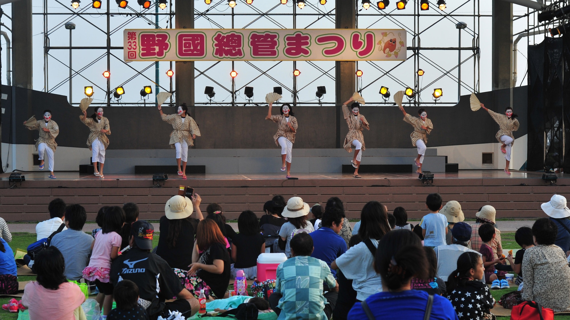 Chondara dancers perform before the Taiko drummers take the stage during the Noguni Sokan Festival in Kadena Town, Okinawa, Oct. 12, 2013. The chondara's job is to entertain bystanders watching the Taiko drummers. (U.S. Air Force photo by Staff Sgt. Rachelle Coleman)