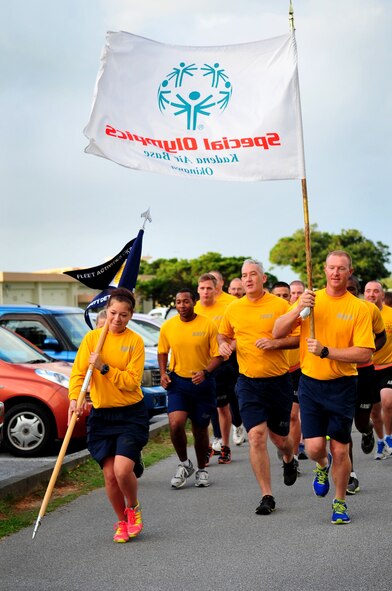 U.S. Navy members from Fleet Activities Okinawa Security Detachment run during the Kadena Special Olympics Jog-a-Thon at Marek Park on Kadena Air Base, Japan, Oct. 16, 2013. Team Kadena members participated in a 24-hour Jog-a-Thon in support of the 14th annual Kadena Special Olympics which is scheduled for Nov. 2. (U.S. Air Force photo by Staff Sgt. Amber E. N. Jacobs)