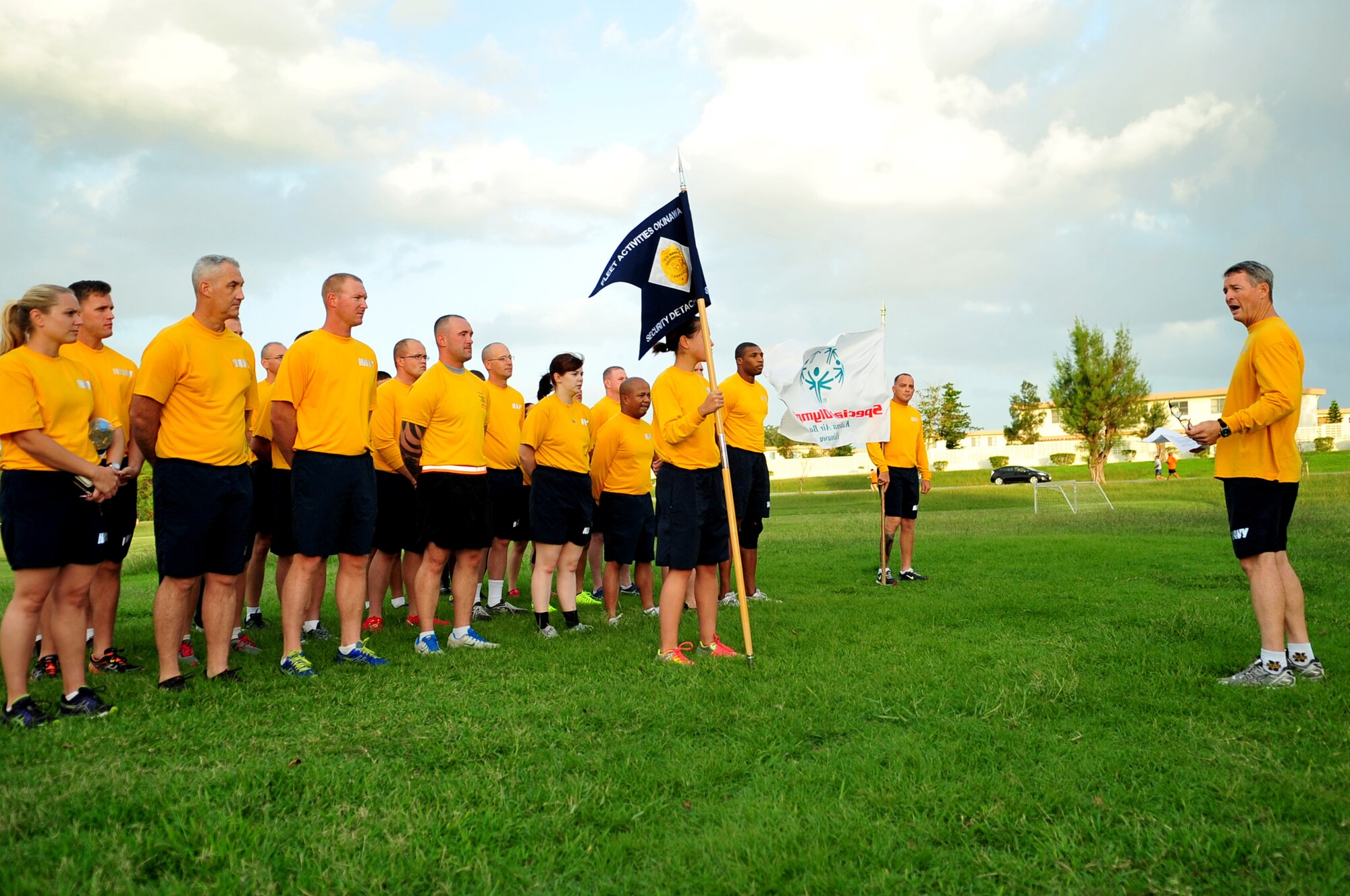 U.S. Navy Capt. Michael D. Michel, Fleet Activities Okinawa commanding officer, speaks to members from Fleet Activities Okinawa Security Detachment and Team Kadena members as part of the Kadena Special Olympics Jog-a-Thon kick-off at Marek Park on Kadena Air Base, Japan, Oct. 16, 2013. The Jog-a-Thon was held in support of the 14th annual Kadena Special Olympics, a program sponsored by the base as a way to give back to the local community and by supporting Japanese special-needs athletes. (U.S. Air Force photo by Staff Sgt. Amber E. N. Jacobs)