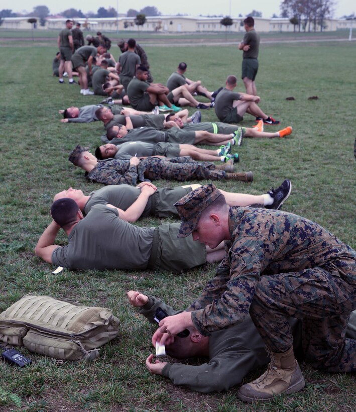 Marines with Black Sea Rotational Force 14 role play as casualties while corpsmen and combat lifesaver certified Marines with BSRF-14 begin triaging and treating them as part of a mass casualty drill conducted at Mihail Kogalniceanu, Romania, Oct. 14, 2013. Being able to implement mass casualty protocol at any given moment will directly affect BSRF-14's mission of being the crisis-contingency force in the Eastern European region.