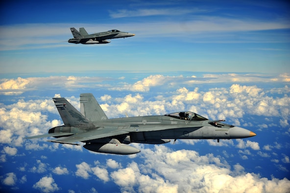 Two Royal Australian Air Force F/A-18 Hornets form up in preparation to conduct an air refuel while participating in Cope North 13 Feb. 13, 2013, near Anderson Air Force Base, Guam. The F/A-18 is a multi-role fighter designed for both air-to-air and air-to-ground missions. Cope North is an annual air combat tactics, humanitarian assistance and disaster relief exercise designed to increase the readiness and interoperability of the U.S. Air Force, Japan Air Self-Defense Force and Royal Australian Air Force. (U.S. Air Force photo/Senior Airman Matthew Bruch)
