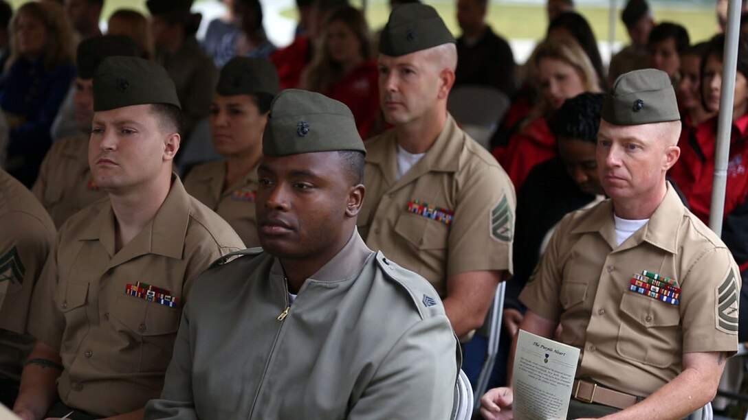 More than 100 Marines, sailors along with their friends and families attend the Purple Heart Memorial unveiling at the Wounded Warrior Battalion-East barracks aboard Marine Corps Base Camp Lejeune, Oct. 11. The Purple Heart Medal is the oldest medal still awarded in the U.S. military. The medal is unique because service members are not recommended for it, but are entitled to receive the award if they have met the criteria.
