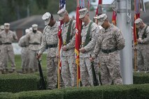 Marines and sailors with 2nd Marine Logistics Group participate in a change of charge ceremony in which Master Chief Petty Officer Russell W. Folley relinquishes charge to Master Chief Petty Officer Christopher M. Cain aboard Camp Lejeune, N.C., Oct. 16, 2013. (U.S. Marine Corps still photo by Cpl. Jessica S. Gonzalez)