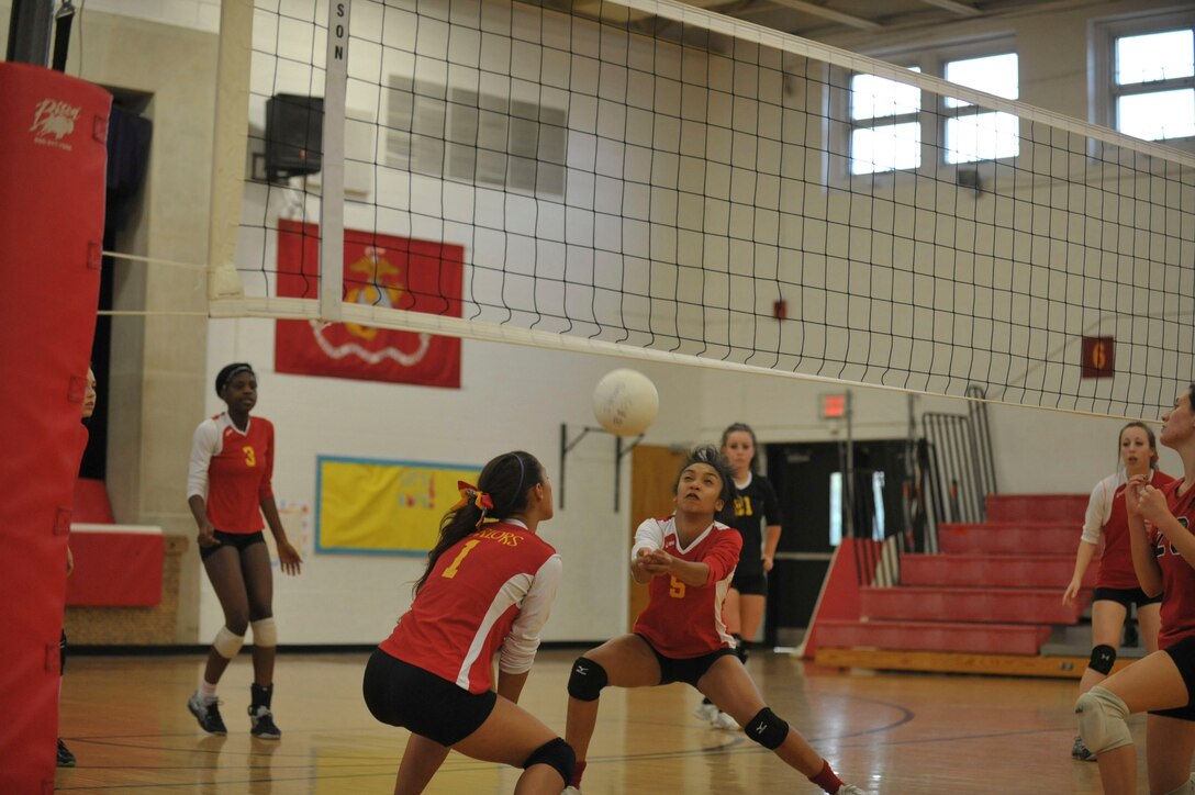 Marquis, Quantico Varsity Volleyball Team’s captain prepares to return a pass during a match against Grace Preparatory School hosted at the Quantico Middle/High School on Oct. 8, 2013. Quantico won three games in a row against the Grace Preparatory team.