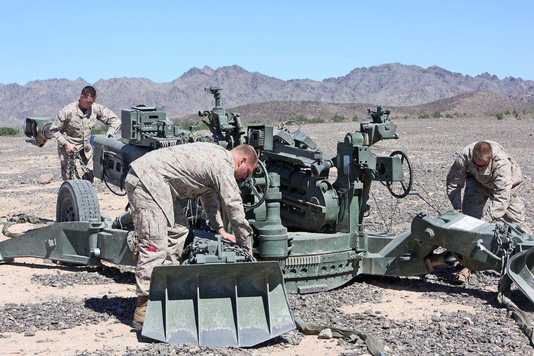 Marines with Landing Support Company, Combat Logistics Regiment 17, 1st Marine Logistics Group, prepare to transport an M777 Howitzer during a Helicopter Support Team operation, supporting Weapons and Tactics Instructor Course 1-14, near Yuma, Ariz., Oct. 5, 2013. An HST allows the rapid deployment of weapons systems, equipment and supplies across long distances through rotary wing aircraft. 