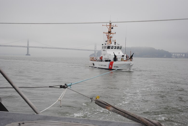 Crew members from the M/V John A. B. Dillard, Jr., a San Francisco District command and control vessel, conduct emergency towing exercises with U.S. Coast Guard Cutter Pike July 9. The two crews met just south of the Bay Bridge near Treasure Island, where they completed a series of tow and be-towed maneuvers.