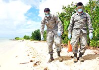 Senior Airmen Jose Rivera and Jose Garcia scour the beachfront area during a recent training exercise, held Sept. 27 on Hickam Beach. The purpose of the search and recovery team is to respond to military-related incidents on base, including military vehicle, aircraft mishap and mass casualty incidents, if and when they occur. (U.S. Air Force photo by Senior Airman Christopher Stoltz)