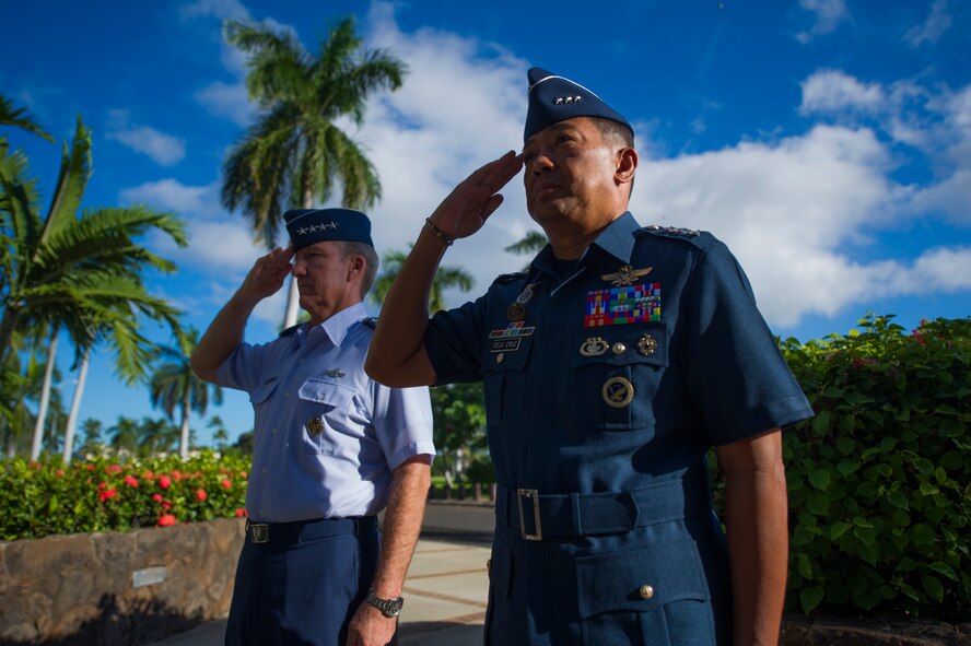 (From left) Gen. Hawk Carlisle, Pacific Air Forces commander, and Lt. Gen. Lauro Catalino G. Dela Cruz, Commanding General of the Philippine Air Force, salute before walking through an Honor Cordon outside the entrance to the Pacific Air Forces headquarters building Oct. 16, 2013, at Joint Base Pearl Harbor-Hickam, Hawaii. Carlisle and Dela Cruz discussed future potential engagements that will help assist the Philippine and U.S. Air Force promote regional security and stability. This is Dela Cruz’s first visit to PACAF and was a reciprocal visit to the one Carlisle made to the Philippines in January. (U.S. Air Force photo/Staff Sgt. Nathan Allen)