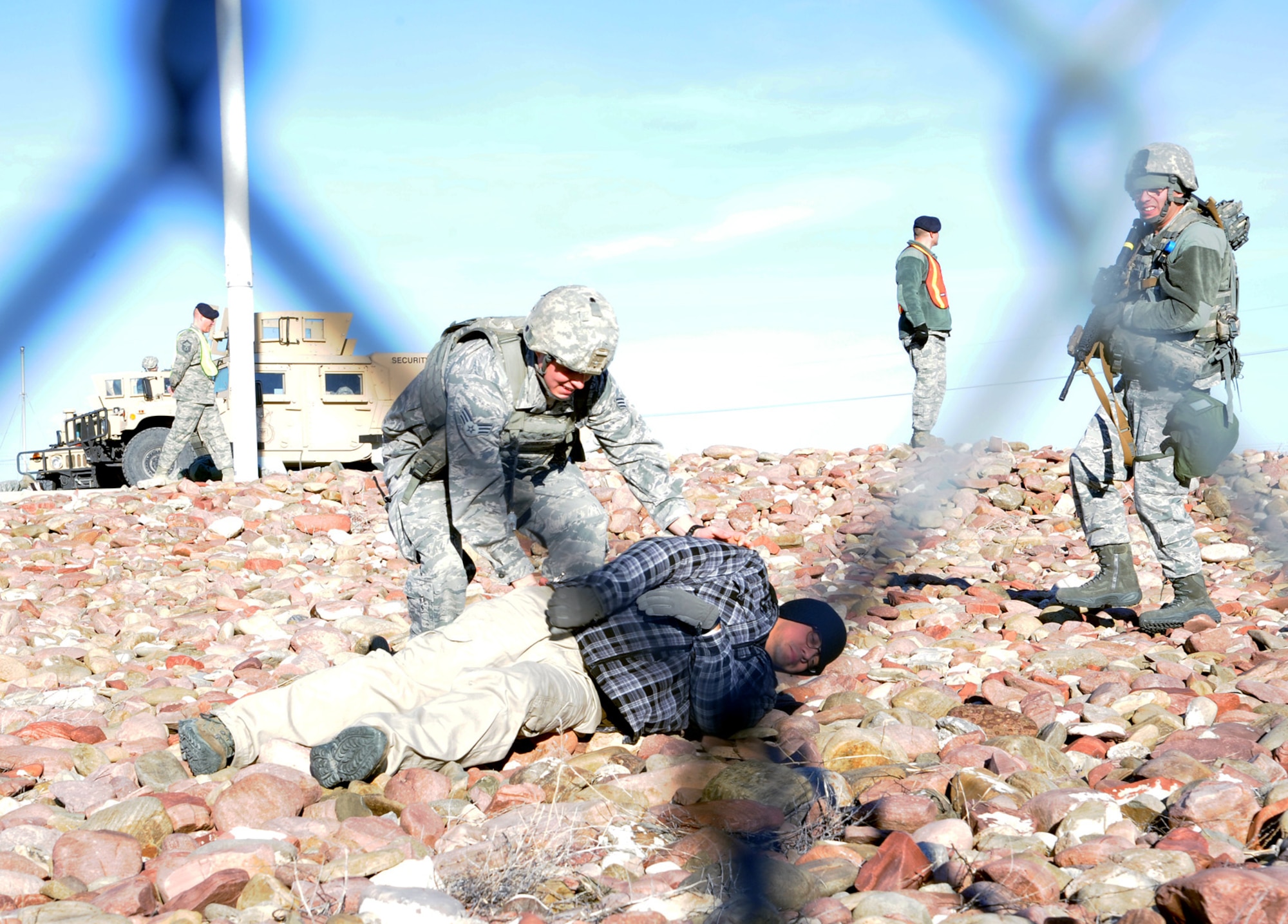 A 741st Missile Security Forces Squadron Airman searches an exercise casualty during a Launch Facility recapture exercise Oct. 15 near Power, Mont. The exercise allowed Airmen to practice emergency procedures in the event an individual or group gained access to an LF. (U.S. Air Force photo/Staff Sgt. R.J. Biermann)