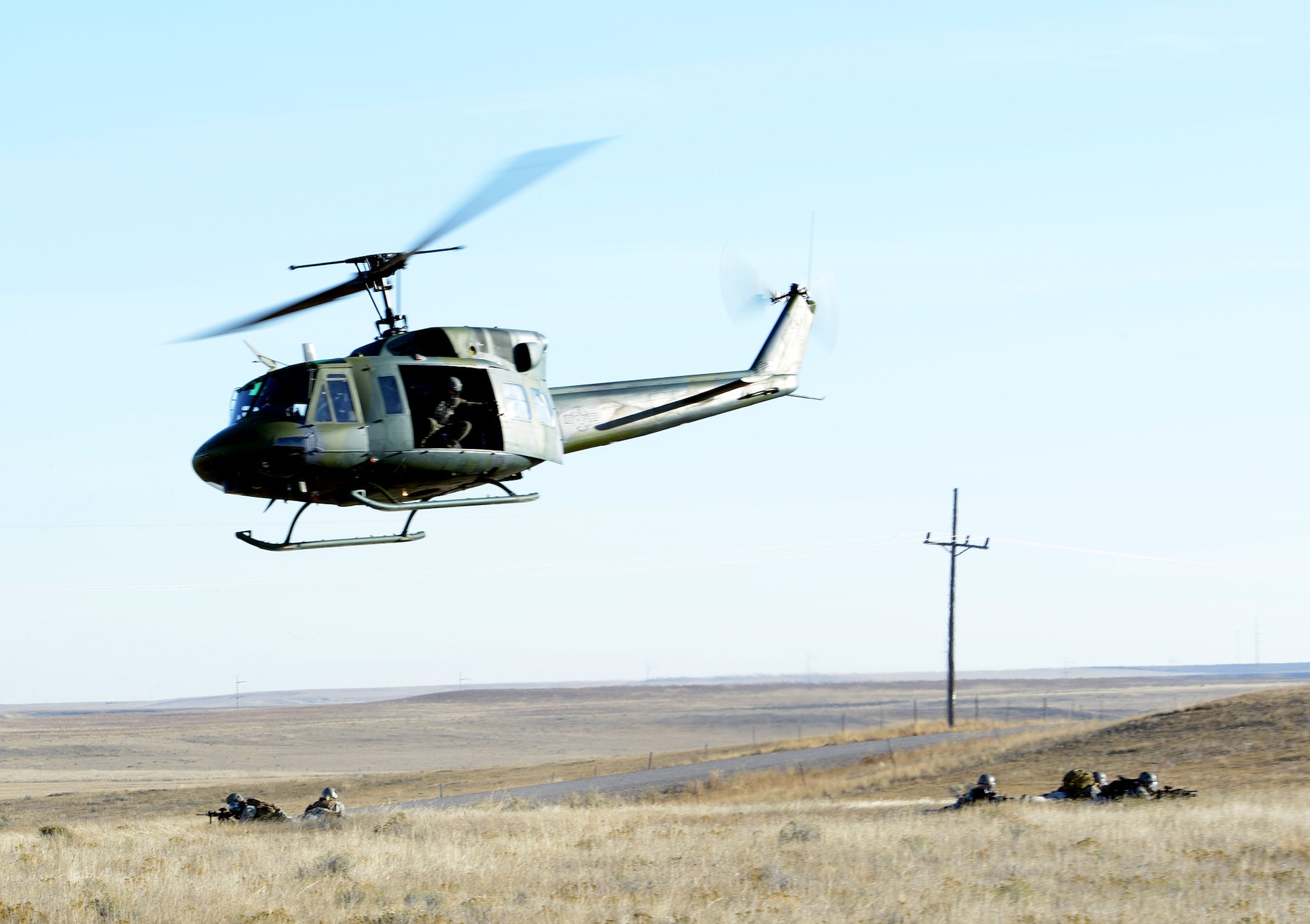 An acting opposing force member pretends to shoot at an initial responding team vehicle during a Launch Facility recapture exercise Oct. 15 near Power, Mont. Several 341st Security Forces Group and 40th Helicopter Squadron members participated in the exercise. (U.S. Air Force photo/Staff Sgt. R.J. Biermann)