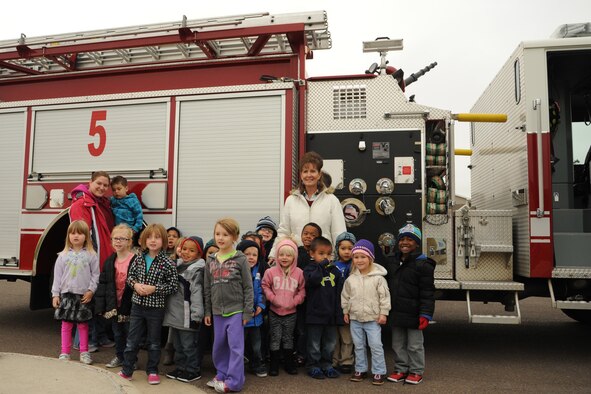 Children from the Malmstrom Child Development Center pose in front of one of the 341st Civil Engineer Squadron’s fire trucks during the fire department’s visit to the CDC on Oct. 9. As part of the Fire Prevention Week celebration, children of all ages had the opportunity to explore the truck, visit with Sparky the Fire Dog and learn about various ways to prevent kitchen fires. (U.S. Air Force photo/Senior Airman Katrina Heikkinen)