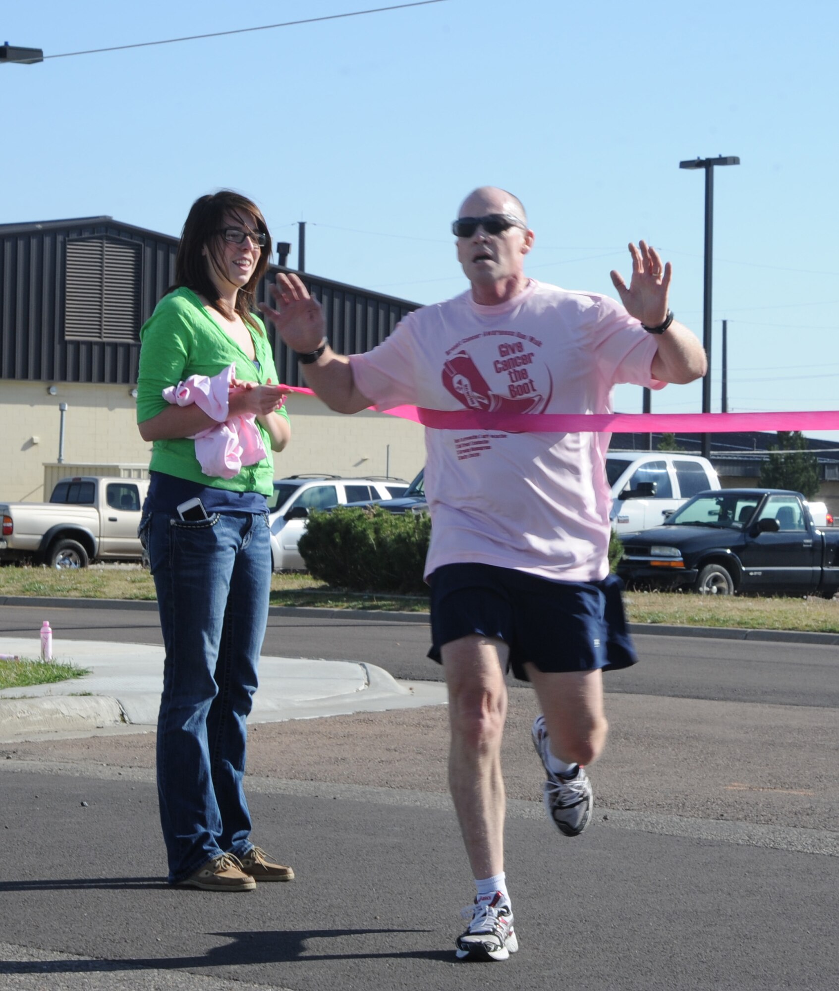 Lt. Col. James Tanner, 341st Medical Operations Squadron chief of physical therapy, finishes first in Malmstrom’s breast cancer awareness 5K run. Tanner was diagnosed with liver failure in 2012 and finished chemotherapy in June. Despite all odds, he earned a perfect score on his last physical fitness assessment. (U.S. Air Force photo/Airman 1st Class Collin Schmidt)