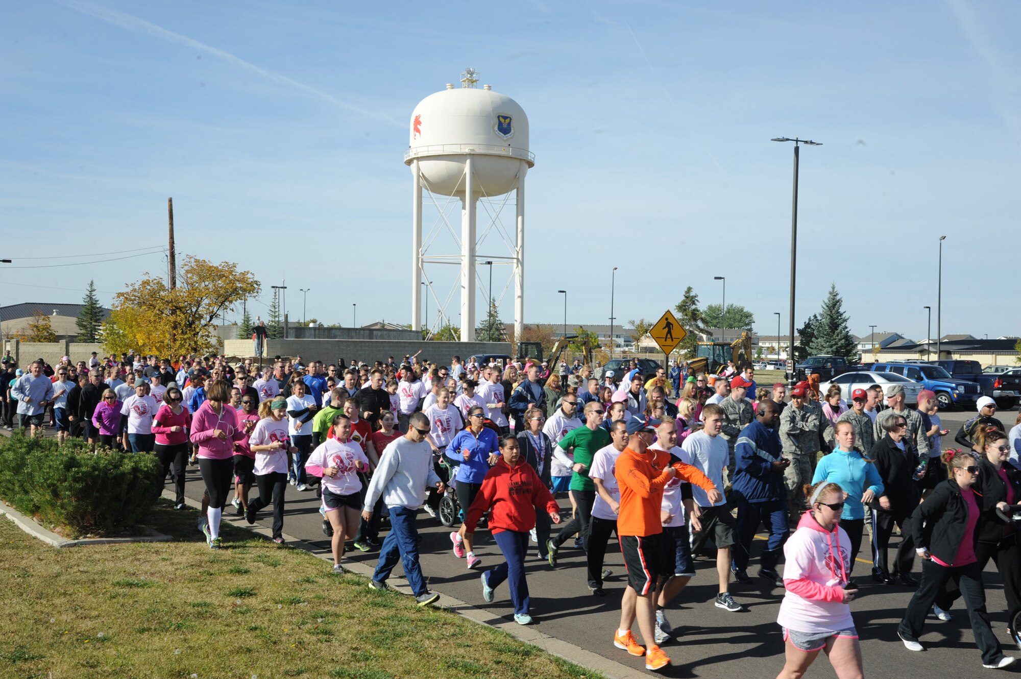 Participants begin Malmstrom’s breast cancer awareness 5K run Oct. 10. The event brought  Team Malmstrom Airmen and members of the community together in support of breast cancer awareness, survivors and the relatives of loved-ones who lost their battle with breast cancer. (U.S. Air Force photo/Airman 1st Class Collin Schmidt)
