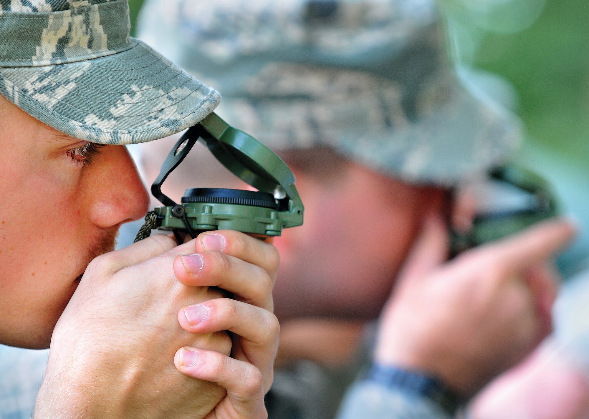 WRIGHT-PATTERSON AIR FORCE BASE, Ohio – Senior Airman Trent Bee, 445th Security Forces Squadron, uses a compass during the land navigation portion of the 445th SFS training exercise Sept. 7. (U.S. Air Force photo/Tech. Sgt. Frank Oliver)