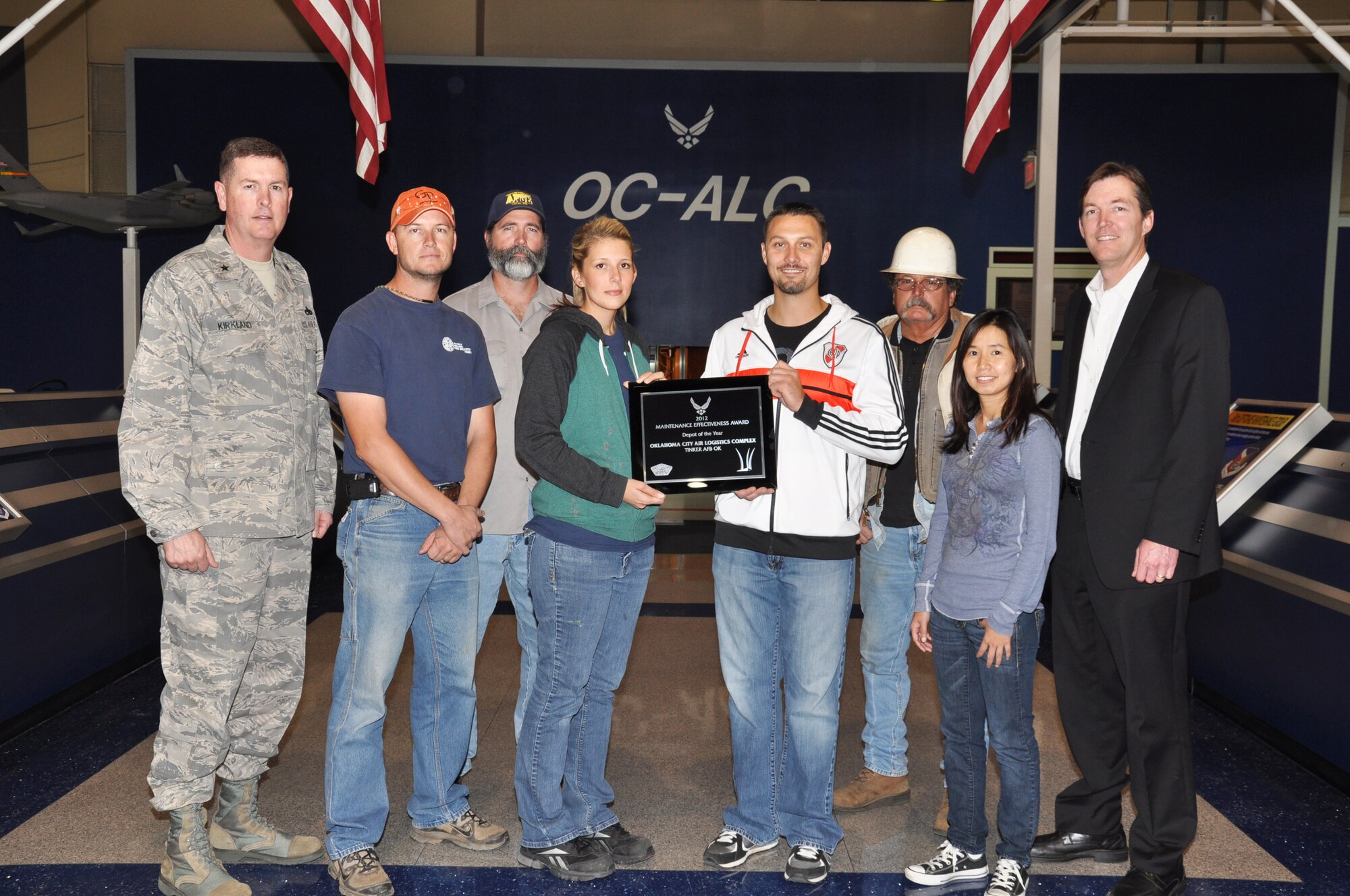 Proudly holding the United States Air Force Maintenance Effectiveness Award for 2012 are Oklahoma City Air Logistics Complex personnel, Laurie Stilwell, 564th Aircraft Maintenance Squadron, and Daniel Wright, 544th Propulsion Maintenance Squadron. Standing with them are Brig. Gen. Gene Kirkland, OC-ALC commander; Shane Brown, 551st Commodities Maintenance Squadron; Jim Bligh, AFGE Local 916 vice president; John Morris, 776th Maintenance Support Squadron; Khanh Nguyen, 555th Software Maintenance Squadron; and Kevin O’Connor, OC-ALC vice director. The 2012 award marks the 4th consecutive year that OC-ALC has earned the Maintenance Effectiveness Award for the Air Force’s best depot. (Air Force photo by Julie LaFollette)