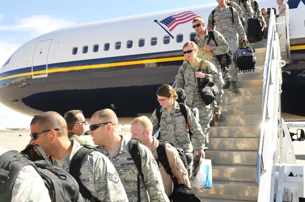 Col. Jay Bickley, 552nd Air Control Wing commander, second from left, was among several senior leaders who turned out Oct. 9 to greet Airmen from his wing returning from a six-month deployment to Southwest Asia. The Airmen were comprised mostly from the 963rd Airborne Air Control Squadron. (Air Force photo by Darren D. Heusel)