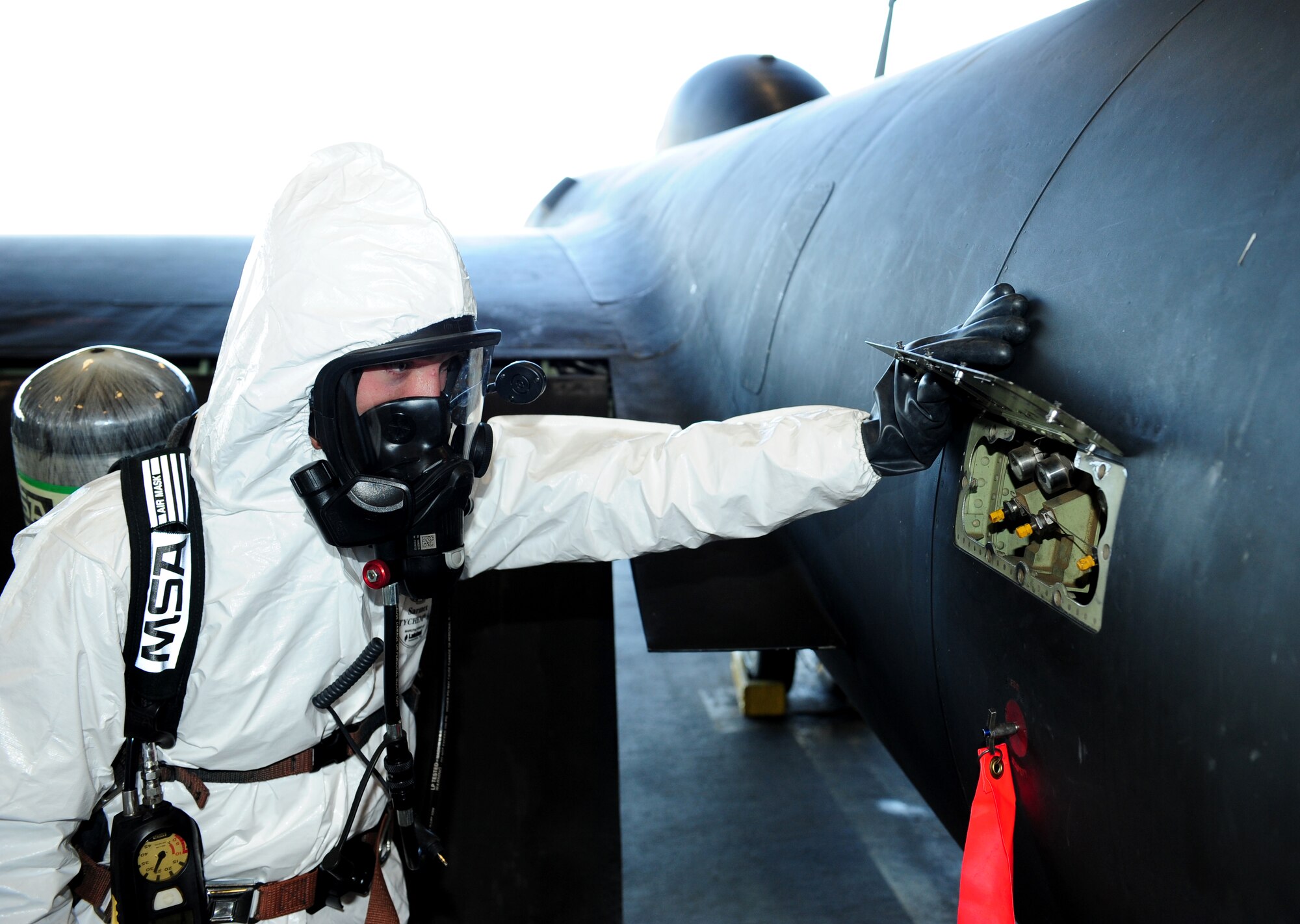 Senior Airman James Everson, 9th Maintenance Squadron aircraft fuels systems technician, inspects a hydrazine indicator on a U-2 Dragon Lady during a hydrazine response exercise Oct. 11, 2013, at Beale Air Force Base, Calif.  Hydrazine enables emergency restarts of the aircraft. (U.S. Air Force photo by Airman 1st Class Bobby Cummings/Released)