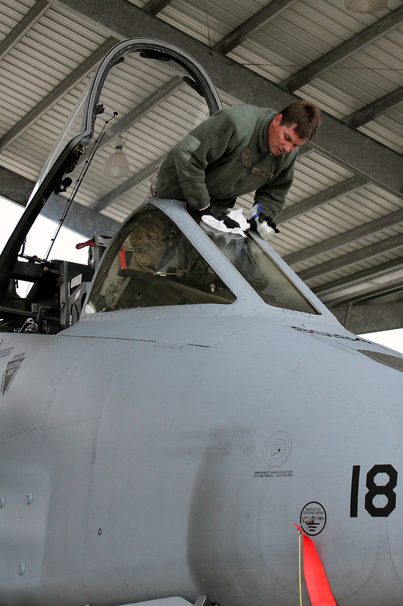 131017-Z-VA676-010 – Senior Airman Jamie Baker cleans the windshield of an A-10 Thunderbolt II prior to flight operations at Selfridge Air National Guard Base, Mich., Oct. 17, 2013. The sorties generated at Selfridge on Oct. 17 were the first for the 127th Wing at the base since before the partial government shutdown began on Oct. 1. Selfridge personnel launched both A-10s and KC-135 Stratotankers on Oct. 17. (Air National Guard photo by TSgt. Dan Heaton / Released)