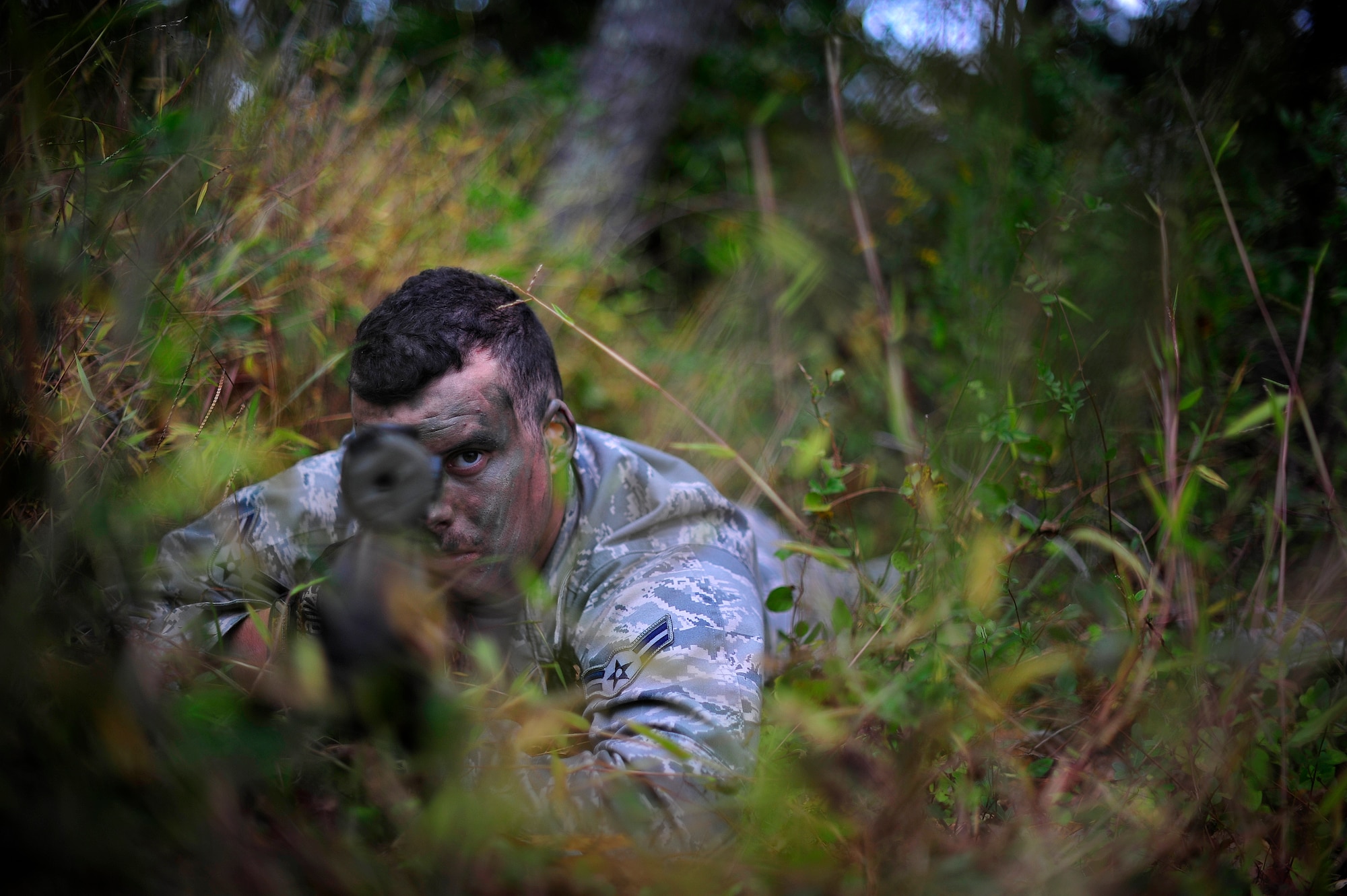 JOINT BASE MCGUIRE-DIX-LAKEHURST, N.J. -- Airman 1st Class Michael Studley, 818th Global Mobility Readiness Squadron close precision engagement course candidate, takes aim during a stalking exercise on a training range here Oct. 9.  Studley and six other candidates were participating in a  621st Contingency Response Wing run, 10-day CPEC indoctrination course to prepare them for the more rigorous 19-day U.S. Air Force CPEC course at Fort Bliss, Texas.  (U.S. Air Force photo by Tech. Sgt. Parker Gyokeres)