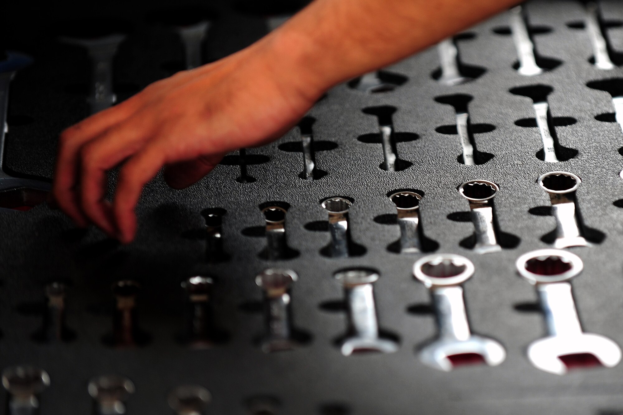 A U.S. Air Force Airman assigned to the 4th Aircraft Maintenance Squadron checks his inventory to ensure all tools are accounted for at Seymour Johnson Air Force Base, N.C., Oct. 10, 2013.  All equipment must be checked prior to  the aircraft taxiing so loose items aren’t sucked into the intake and cause damage.  (U.S. Air Force photo by Airman 1st Class Brittain Crolley) 