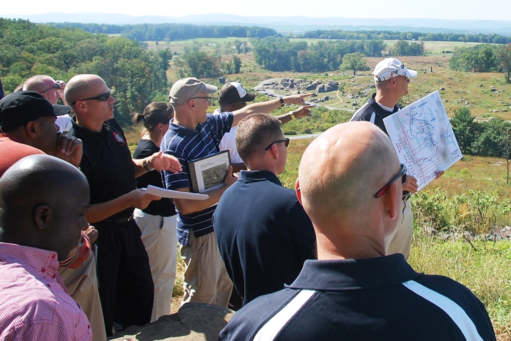 Leaders of the 174th Infantry Brigade discuss the terrain advantages associated with Big Round top and Little Round top during their professional development staff exercise at the Battle of Gettysburg National Park Sept. 19, 2013. (U.S. Army photo by Capt. Antonia Greene-Edwards/Released)