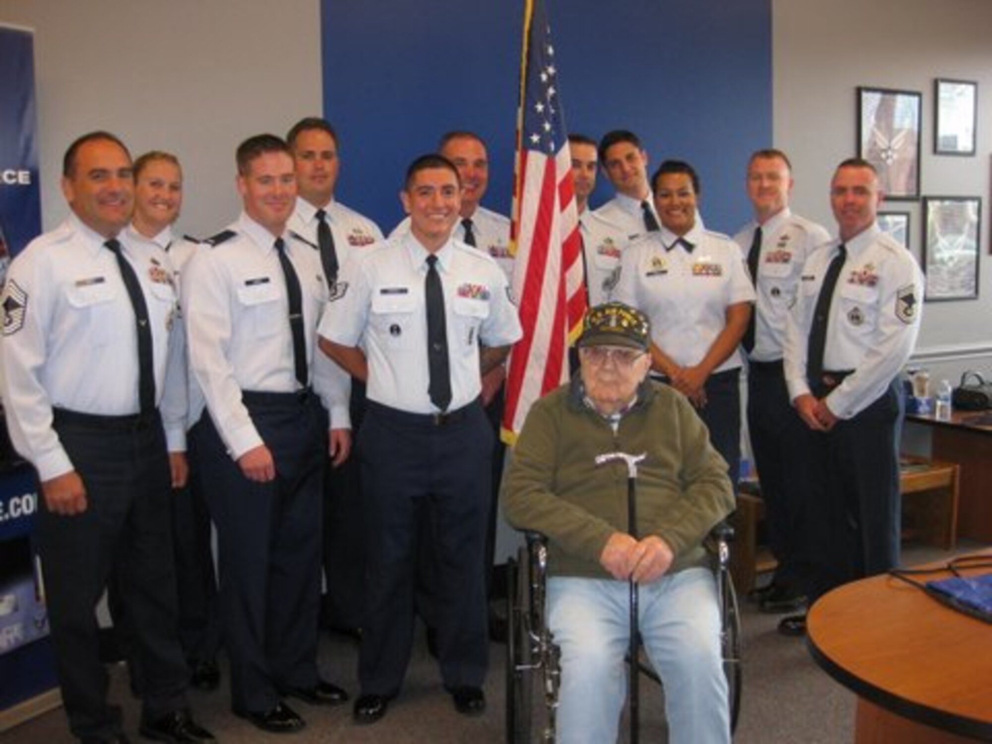 Retired Air Force Chief Master Sgt. Tom Phelan (seated) was honored in a ceremony Aug. 29 by members of the 361st Recruiting Squadron. Pictured from left to right are: (front row) Chief Master Sgt. Andrew Sites, 1st Lt Joshua Jones, Staff Sgt. Ricardo Mendez, Tech. Sgt. Jyoti Smith and Senior Master Sgt. Christopher McBride; (back row) Capt. Kali Kranz, Master Sgt. Patrick Leonard II, Master Sgt. Anthony Pandina, Staff Sgt. Daniel Haymore, Staff Sgt. Zachary Atkinson and Master Sgt. David Brydan. (U.S. Air Force photo)