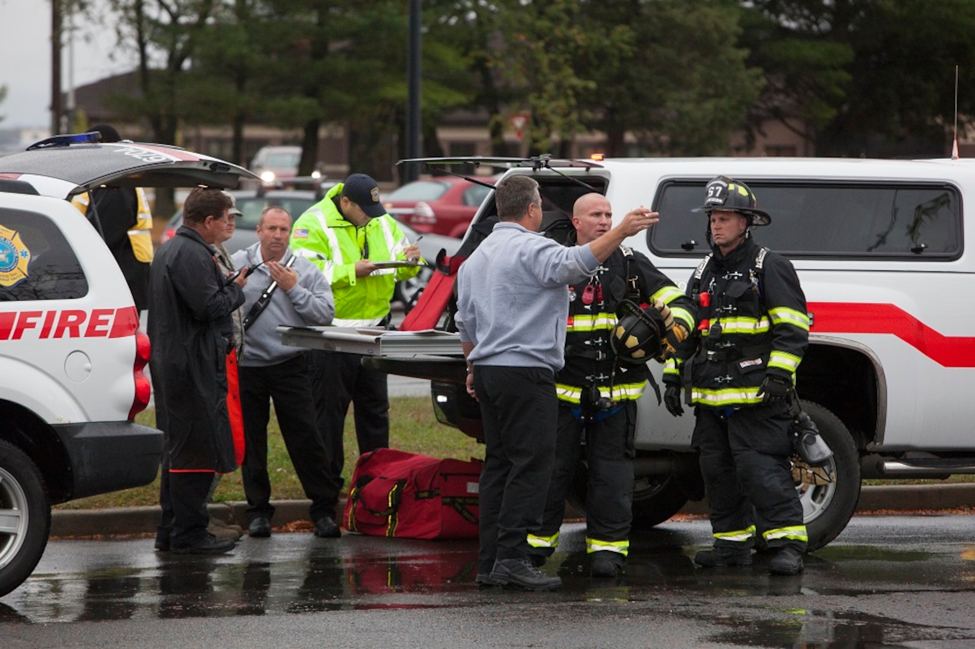 Joint Base McGuire-Dix-Lakehurst emergency response personnel respond to a simulated chemical attack during a Chemical, Biological, Radiological, Nuclear and Explosive exercise Oct. 10, 2013, at JB MDL, N.J. The exercise simulates a chemical gas release to measure the joint base’s responders’ ability to react and work together in the event of a crisis. (U.S. Air Force by Russell Meseroll/Released)