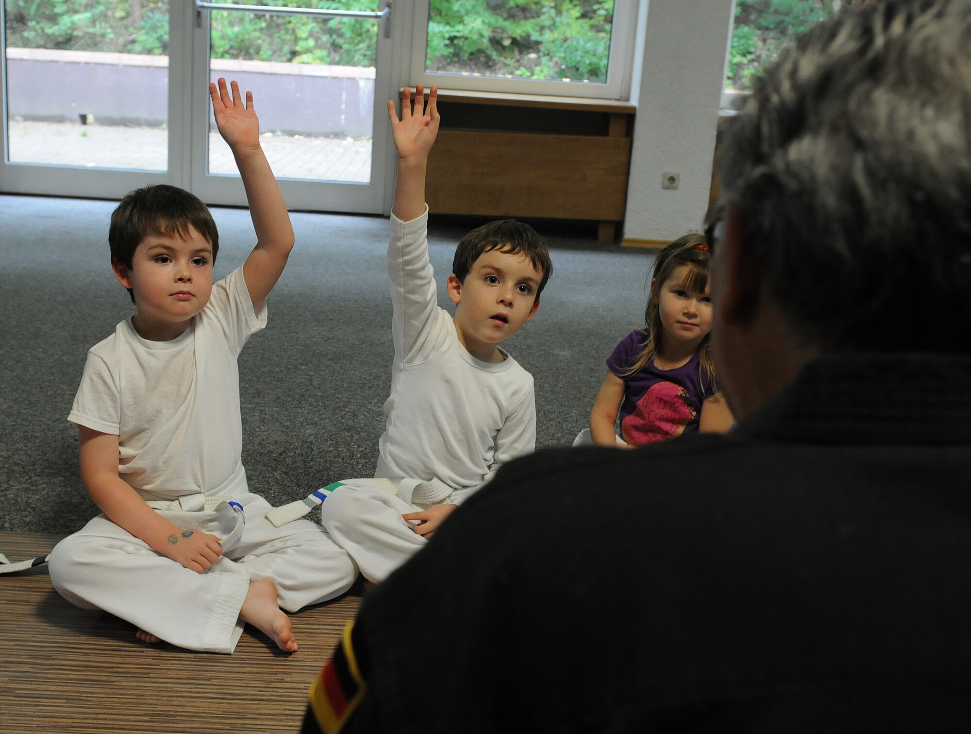 Richard Vasquez, Karate Tech class instructor, quizzes students to evaluate their knowledge of martial arts, Oct. 8, 2013, Vogelweh, Germany. The Karate Tech class helps gain self-discipline, experience in martial arts and enhance physical fitness to KMC members. (U.S. Air Force photo/Airman 1st Class Holly Mansfield)