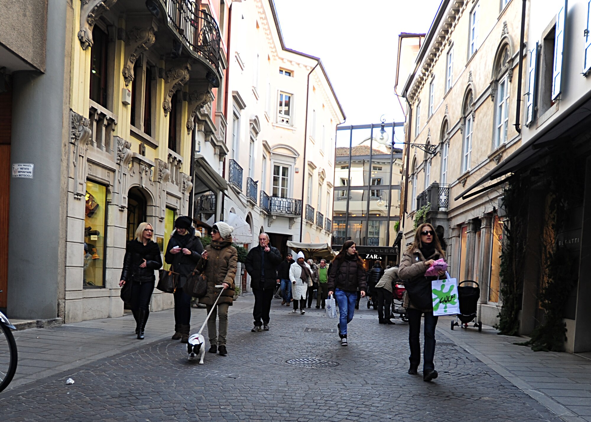 Shoppers walk around the towns center in Udine, Italy.  There are a variety of shopping options in Italy ranging from local vendors and boutiques to malls and outlet centers. (Courtesy photo)

