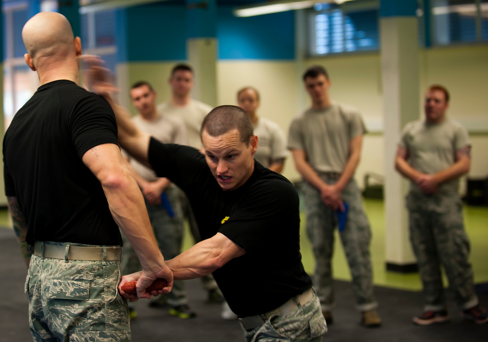 Staff Sgt. Joshua R. Marugg (right), 435th Security Forces Squadron fly-away security team NCOIC, strikes Staff Sgt. Mark M. Karas, 435th SFS F.A.S.T. instructor, Oct. 9, 2013, Pulaski Barracks, Germany. The F.A.S.T. instructors teach more than 60 trainees per year skills to help them protect themselves, aircrews and military assets. (U.S. Air Force photo/Airman 1st Class Damon Kasberg)