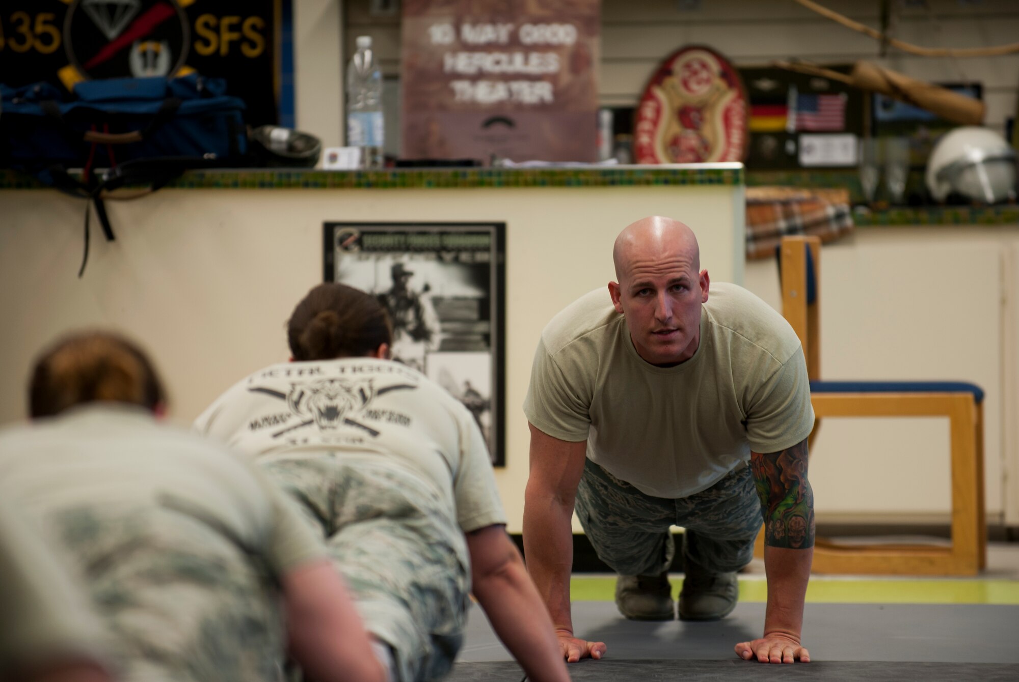 Staff Sgt. Mark M. Karas, 435th Security Forces Squadron fly-away security team instructor, leads a physical-training session, Oct. 9, 2013, Pulaski Barracks, Germany. Many instructors for F.A.S.T. have completed the Phoenix Raven program, which specializes in aircraft security under hostile conditions. (U.S. Air Force photo/Airman 1st Class Damon Kasberg)