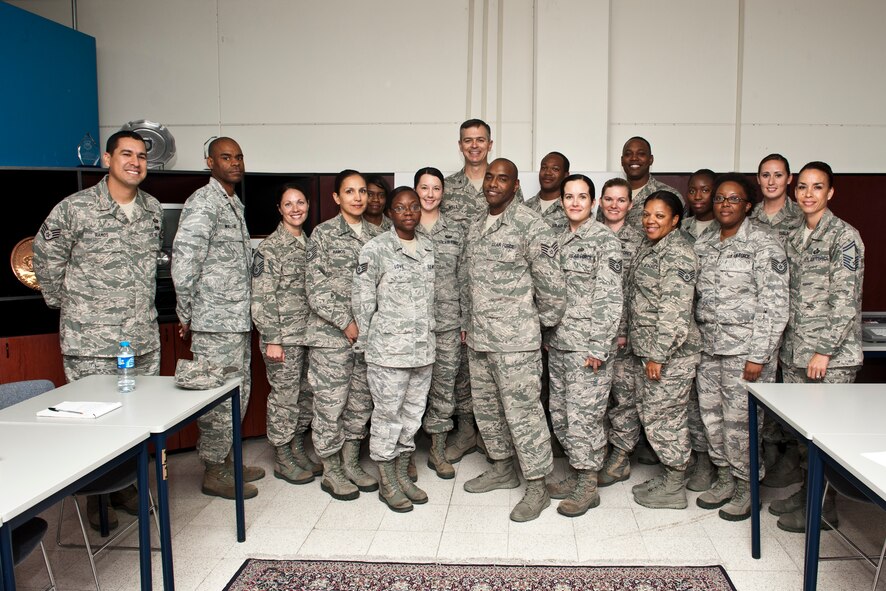 Staff Sgt. Ricardo Wood, 39th Force Support Squadron passport agent, poses with his team and 39th Air Base Wing leadership for a group photo Oct. 16, 2013, Incirlik Air Base, at Turkey. "Pick of the 'Lik’" recognizes outstanding members of Team Incirlik who display a commitment to excellence. Airmen are nominated by their squadron supervision and selected by 39th ABW senior leadership for recognition. (U.S. Air Force photo by Senior Airman Daniel Phelps/Released)