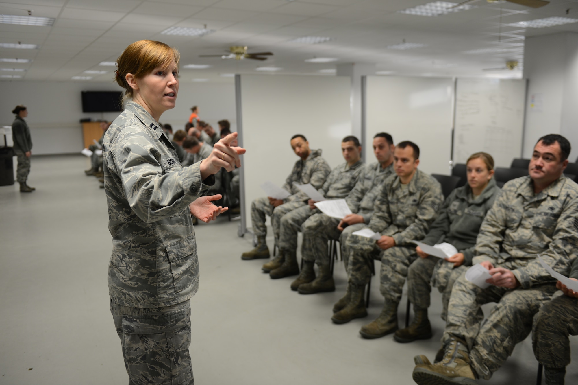 SPANGDAHLEM AIR BASE, Germany – U.S. Air Force Capt. Elizabeth Schnabel, 52nd Medical Operations Squadron clinical audiologist from Medina, Ohio, briefs military members on the point of distribution exercise process Oct. 16, 2013. Exercise participants had to attend the briefing before moving on to the next portion of the exercise. (U.S. Air Force photo by Airman 1st Class Gustavo Castillo/Released) 