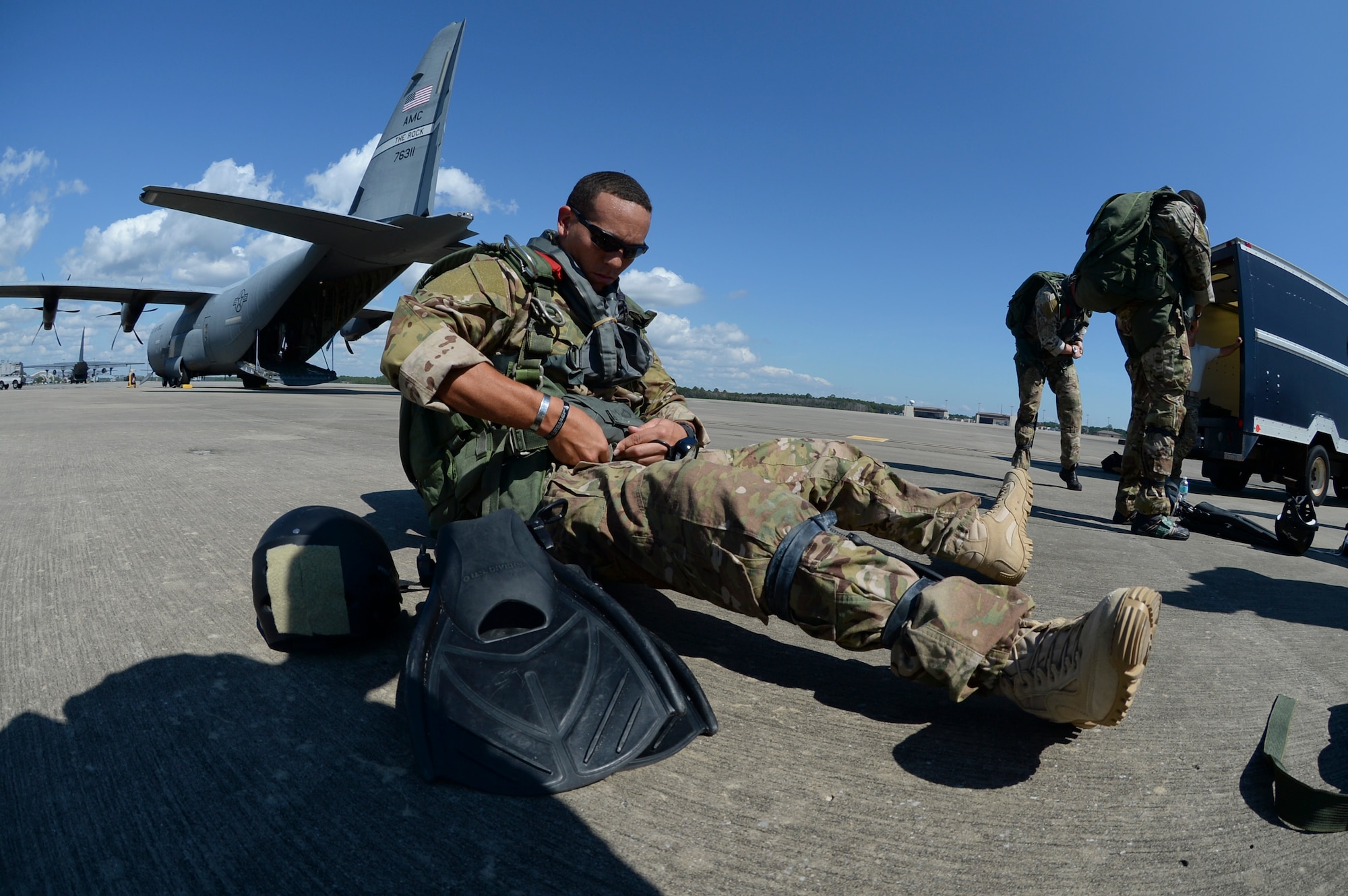 Staff Sgt. Johnnie Yellock Jr. prepares for his final jump before being medically retired Oct. 16, 2013, at Hurlburt Field, Fla. Yellock endured 28 surgeries and two years of intense physical therapy to be able to walk again after his vehicle was struck by an improvised explosive device during a 2011 deployment to Afghanistan. Yellock is  a 23rd Special Tactics Squadron combat controller. (U.S. Air Force photo/Staff Sgt. John Bainter)