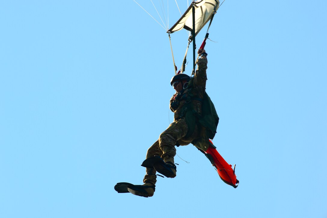 Staff Sgt. Johnnie Yellock Jr. parachutes down after completing his final free fall jump before being medically retired Oct. 16, 2013, at Hurlburt Field, Fla. Yellock endured 28 surgeries and two years of intense physical therapy to be able to walk again after his vehicle was struck by an improvised explosive device during a 2011 deployment to Afghanistan. Yellock is a 23rd Special Tactics Squadron combat controller. (U.S. Air Force photo/Staff Sgt. John Bainter)