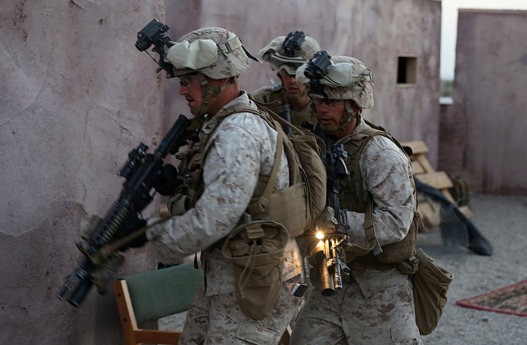 Marines swarm mock town during raid training