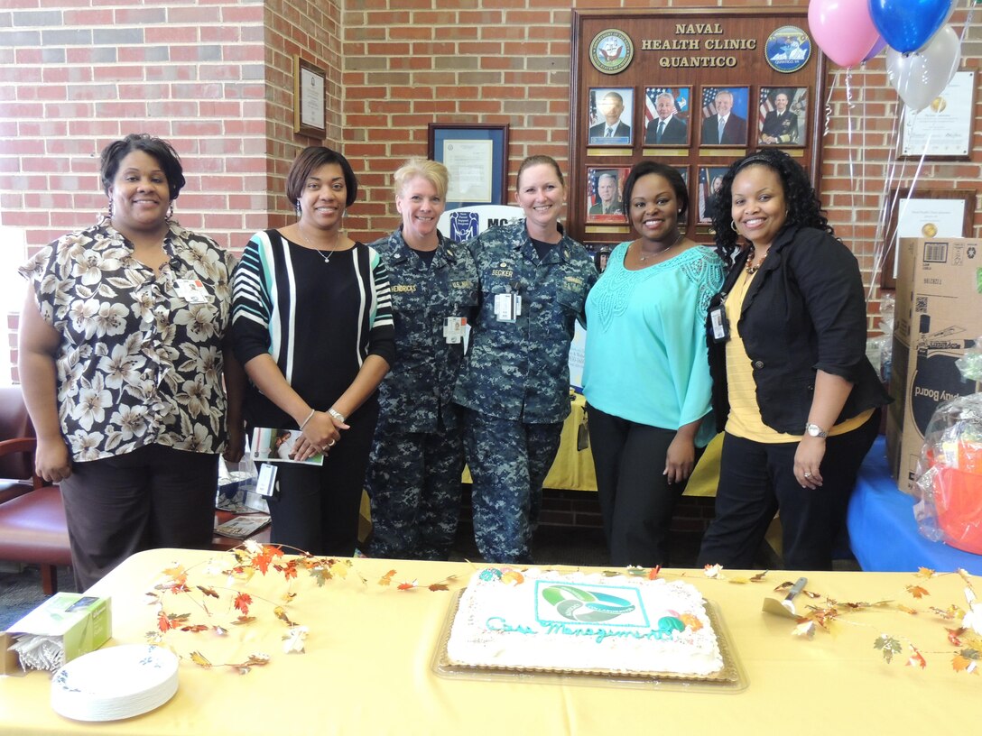 Naval Health Clinic Quantico case managers celebrate National Case Management Week with a cake cutting Oct. 15. From left are Monica Dompey, Tanisha Gibson, Cmdr. Maryellen Hendricks, clinic commanding officer Capt. Kathy Becker, Jennifer Worthy and Hazel Edwards. 