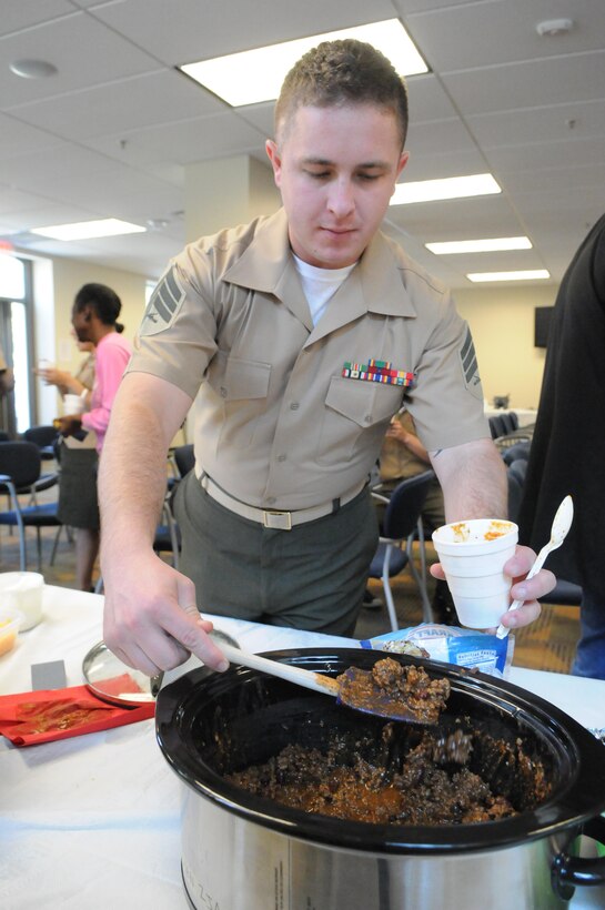 Sgt. Evan Hunt, base Motor Transport operator, gets a helping of chili during the Headquarters and Service Battalion’s chili cook-off at Yale Hall on Oct. 4. 