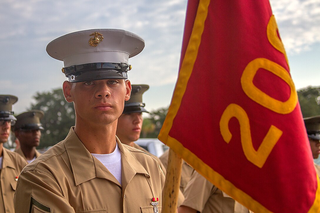 Pfc. Jack Boles, honor graduate for platoon 2080, stands at parade rest before graduation starts graduation aboard Parris Island, S.C., Oct. 18, 2013. Boles, native of Alpharetta, Ga., was recruited by Staff Sgt. Marvin Buruca, recruiter from Recruiting Substation Atlanta, Recruiting Station Atlanta, will be able to enjoy some much deserved leave with his family as he prepares for Marine Combat Training in Camp Geiger, N.C. (U.S. Marine Corps photo by Lance Cpl. John-Paul Imbody)