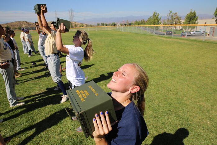 Mollie Sorenson, varsity softball player for West Ranch High School pushes to get her last ammunition can lifts in before time ran out at the West Ranch High School, Oct. 1. Althletes from the schools softball and baseball teams participated in a Combat Fitness Challenge which was ran by the United States Marine Corps.